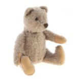 A Steiff teddy bear, mid 20th c, in faded mohair with felt pads, 19cm  h