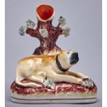A Staffordshire earthenware bull mastif spill holder, mid 19th c, 14cm h Good condition