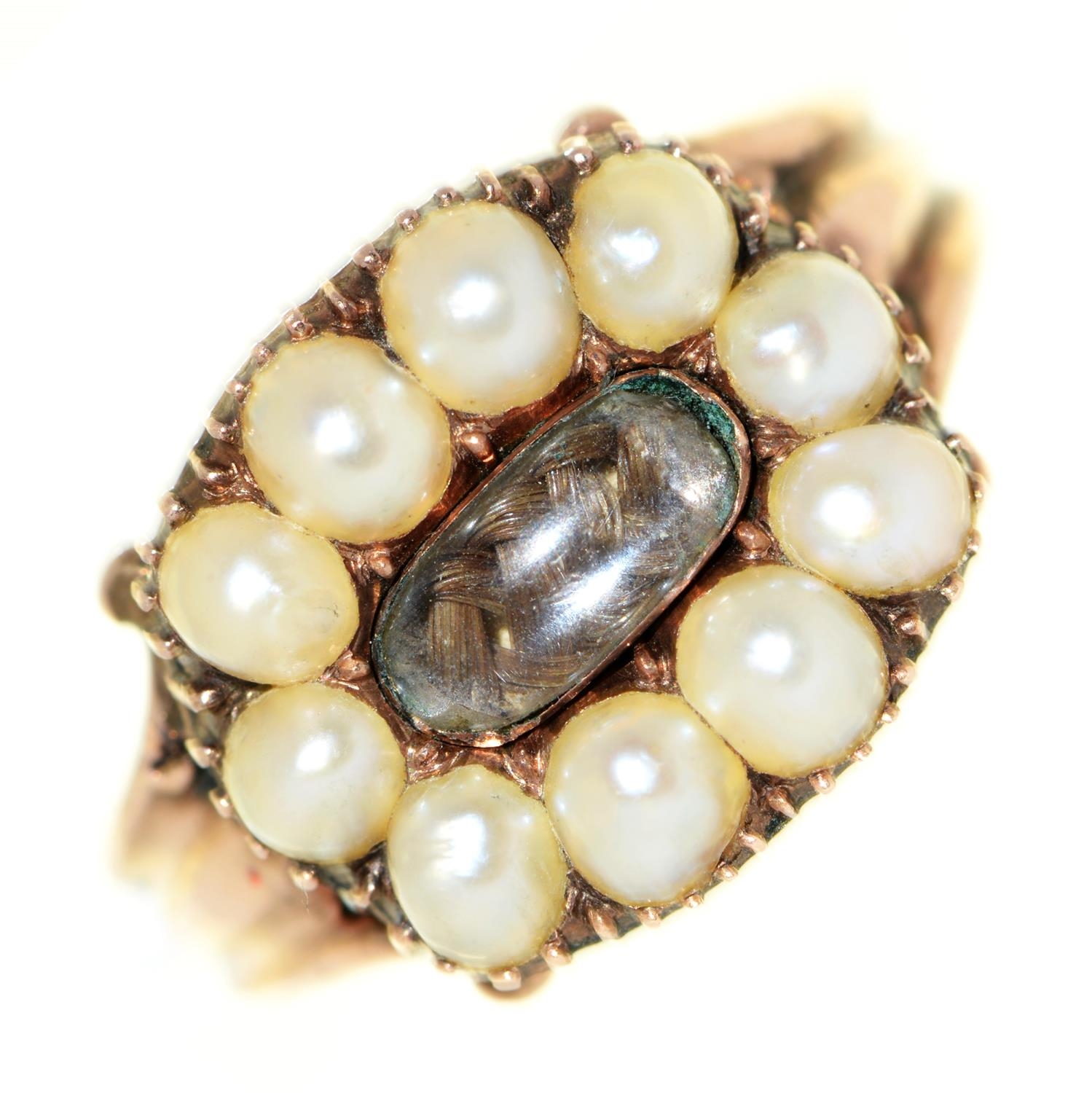 A Georgian gold mourning ring, early 19th c, with locks of hair in split pearl surround, fluted gold