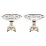 A pair of Victorian pierced and die stamped silver fruit stands, with flat centre and scalloped