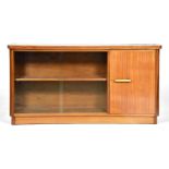 A mid century light wood bookcase, c1960, of solid and laminate construction, adjustable shelves,