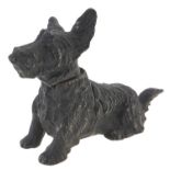 A cold painted spelter combination table cigarette lighter and ashtray in the form of a terrier,