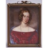 English School, 19th century Portrait Miniature of a young Lady, bust length in a red dress