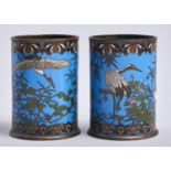 A pair of Chinese cylindrical cloisonne enamel vases, late 19th / early 20th c, with cranes and