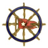 Shipping Memorabilia. A White Star Line SS "Baltic" gilt metal and enamel ship's wheel souvenir