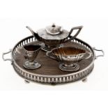 An Edwardian silver toy tea service, including circular tray with oak base, 90mm over handles, by