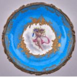 A French ormolu mounted Sevres style tazza, late 19th c, incorporating a saucer, painted with