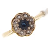 A sapphire and diamond cluster ring, in 18ct gold, London 1968, 3g, size L Good condition