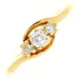 A three stone diamond ring, in gold marked 18ct, 2.5g, size N Light wear