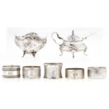 A Continental silver sugar bowl, embossed with c-scrolls and foliage on cherub feet, 90mm diam,