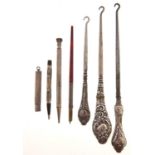 Three silver handled button hooks, various lengths, makers and dates, c1900, two pencils, the sheath