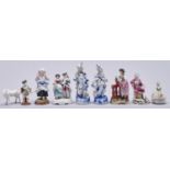Four, a pair and a group of German porcelain fairings and other figures, late 19th c and later, in