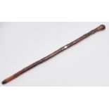 A Japanese carved and stained bamboo walking cane, early 20th c, with applied bone detail and