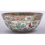 A Canton famille rose bowl, second half 19th c, typically decorated with birds, insects, peaches and