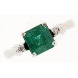 An emerald and diamond ring, with larger central step cut emerald, in 9ct white gold, 2.2g, size G