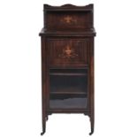 A Victorian inlaid rosewood music cabinet, with glazed door, on pottery castors, 126cm h; 36 x