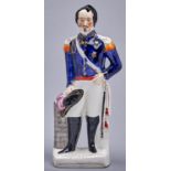 A Staffordshire flatback portrait figure of Napoleon III, c1854, the oblong base inscribed LOUIS