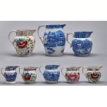 Eight painted or blue printed pearlware and other earthenware jugs, c1800-1840, largest 23cm h