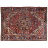 An antique Heriz carpet, early 20th c, 272 x 373cm Localised wear and soiling