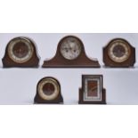 A walnut mantel clock, 1930's, 24cm h and four various contemporary oak and walnut mantel clocks (5)