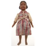 A Swiss carved and painted wood character doll, in contemporary striped costume, second quarter 20th
