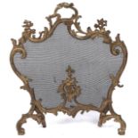 A gilt lacquered brass and wire mesh rococo revival fire screen, early 20th c,  74cm h Dirt/gilt