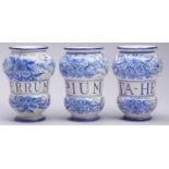 A set of three Italian maiolica albarelli, 20th c, boldly painted in blue with stylised flowers