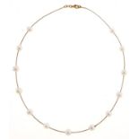 A 14ct gold necklet with cultured pearls at intervals, 8.8g Good condition