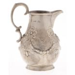 A Victorian silver cream jug, embossed with festoons, crested, 11cm h, by John Bell and Frederick