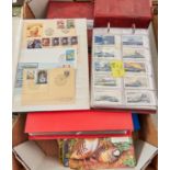 Postage Stamps. A collection of first day covers and albums containing sets of cigarette cards and