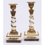 A pair of French ormolu and gilt brass mounted marble candlesticks, c1900, in the form of a column