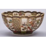 A Japanese Satsuma Kiku form bowl, Meiji period, each flute enamelled with scenes, landscapes or