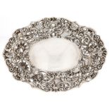 A Victorian pierced and die stamped silver sweetmeat dish, with lightly domed centre and border of