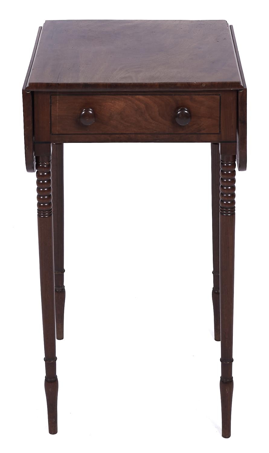 A George IV mahogany dropleaf table, early 19th c, fitted with a drawer and opposing dummy drawer,