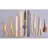 A group of bone and ivory accessories, late 19th c, to include four pairs of glove stretchers and