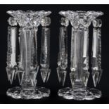 A pair of cut glass lustres, late 19th c, of trumpet shape on scalloped foot, with prismatic cut