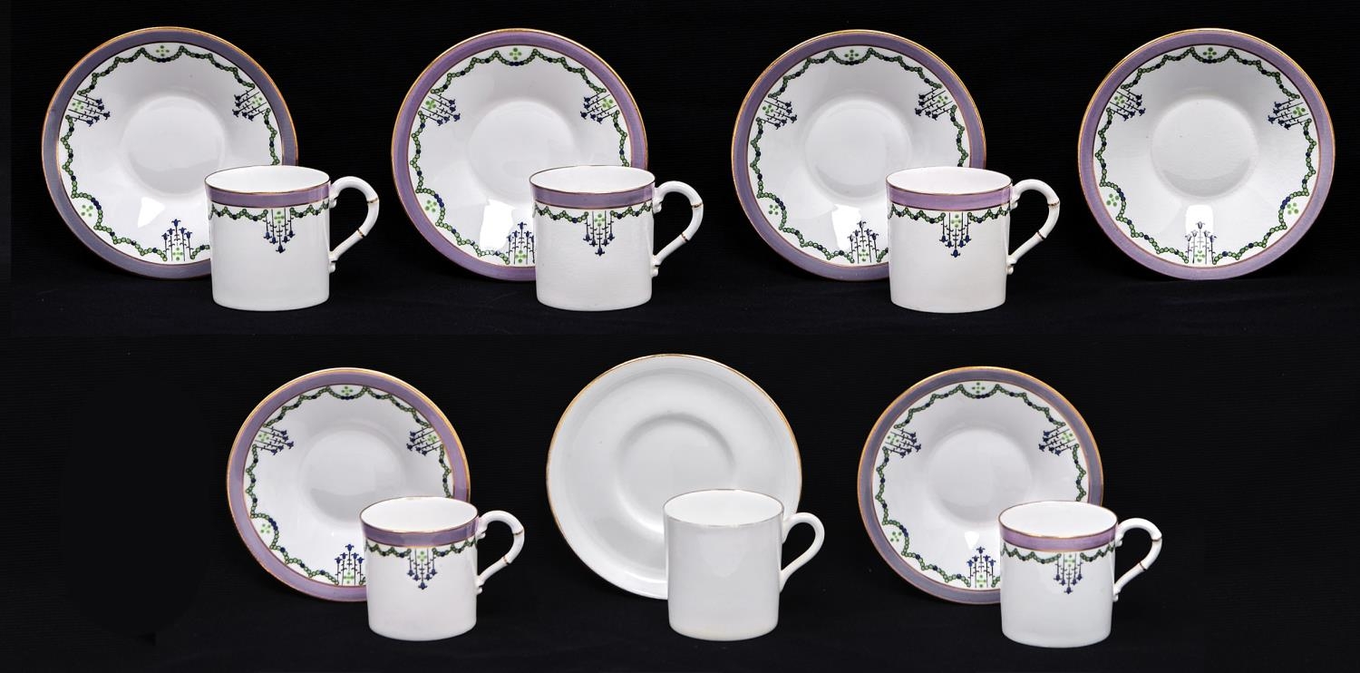 A set of five Royal Worcester coffee cups and saucers, 1914, with green and blue swags and lilac