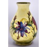 A Moorcroft yellow ground Hibiscus vase, c1970, 21cm h, impressed mark, painted initials, paper