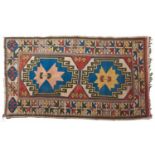 A rug - 135 x 232cm and a smaller light blue ground medallion rug (2) Light wear and slight fading