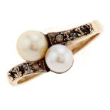 A pearl and white stone crossover ring, in gold, unmarked, 2.5g, size L Light wear scratches