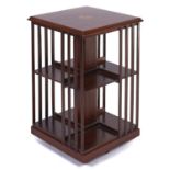 A mahogany and inlaid rotating bookcase, 20th c, in Victorian style, 79cm h; 49 x 49cm Good