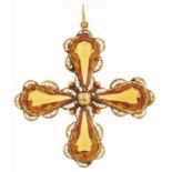 A citrine cruciform pendant, with four pear shaped drops in gold filigree, marked C18, 10.4g Good