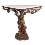 An Italian giltwood console table, 19th c, the marble slab and shaped top held aloft by putti on