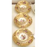 A set of three Coalport yellow ground teacups and saucers, c1825-30, painted with flowers, saucer