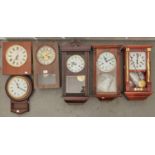 Six modern wall clocks, various sizes