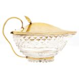 A George III silver gilt mounted cut glass sauce boat, the domed lid with shell thumbpiece, 10.5cm