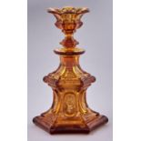 An hexagonal amber glass scent bottle and floriform stopper, late 19th c, gilt decorated, 19cm h