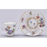 A Vienna style osier moulded trembleuse chocolate cup and saucer, 20th c, painted with flowers,