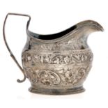 A George III silver cream jug, later chased, 10.5cm h, maker A F, probably Alexander Field, London