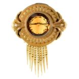 A Victorian gold brooch, c1870, set with a citrine, gold fringed, 55mm drop, 14.7g Edge of brooch